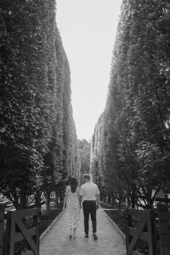 Morgan and Mitch walking hand-in-hand through the gardens at Franklin Park Conservatory.