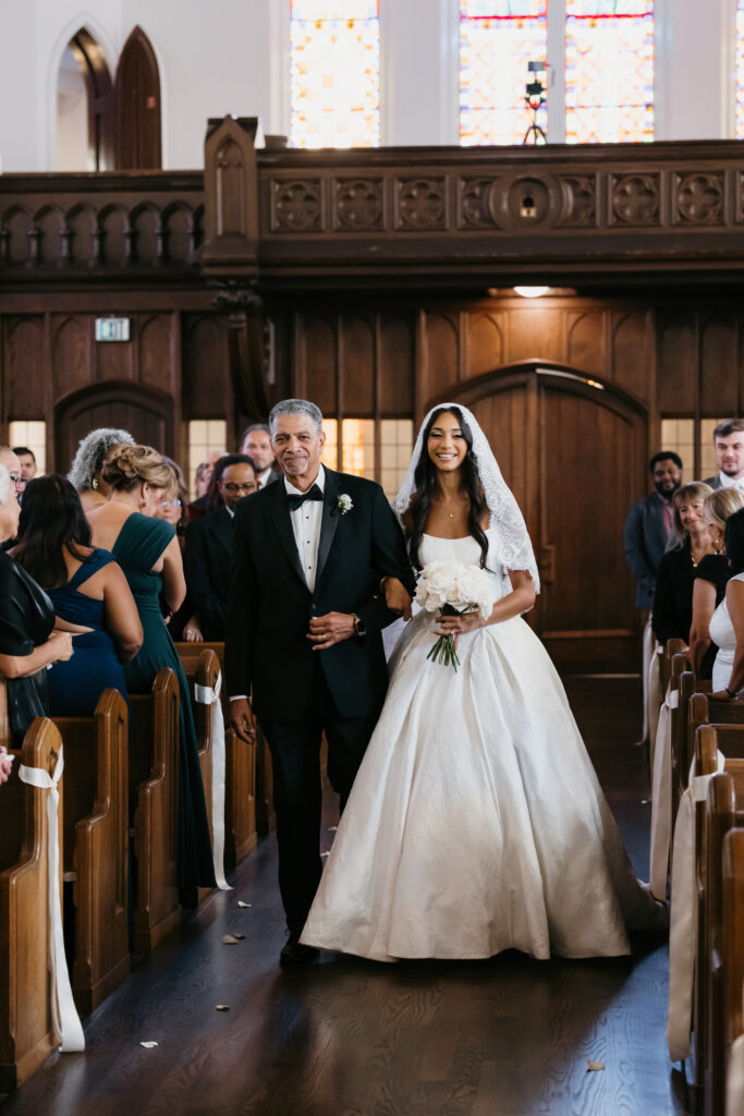 bride and father walking down aisle