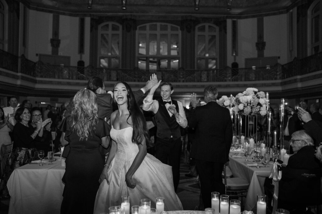 bride and groom entering reception